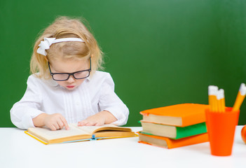 cute little girl in the classroom at school