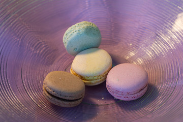 Macarons in different colours on a background