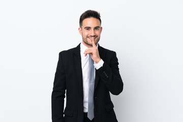 Young business man over isolated background doing silence gesture