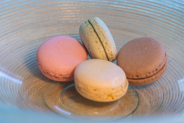 Macarons in different colours on a background