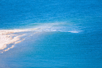 Dead sea, Jordan. Beautiful beach with salt deposits.