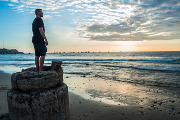 model on the beach at sunset