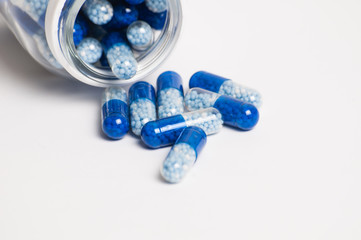 Pills on white background close-up macro. The concept of medicine and protection against coronavirus