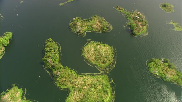Aerial view of Lake Bayano, small islands with palms and cloud forest in Panama Central America, filmed with Cineflex stabilization 5-Axis camera system