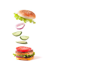 Burger in flight on a white background