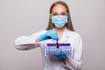 Laboratory technician or woman doctor hold on blood sample tube for corona virus test , COVID 19...