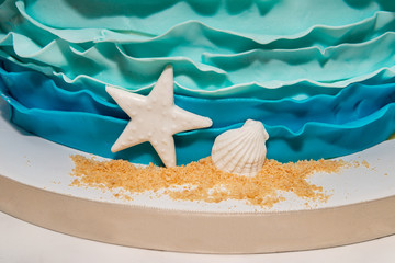 Birthday cake with white starfish and seashell