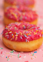 pink donuts with colorful sprinkles 