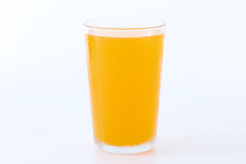 glass of orange juice on white