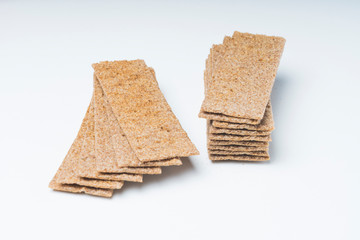 rye crackers on a white background close-up, selective focus