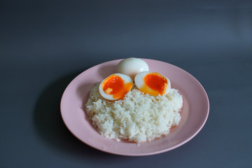 Boiled duck egg and Jasmine rice on a plate, Cheap Thai food