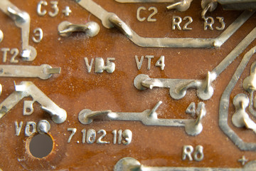 circuit board circuitry, disassembled computer as background,