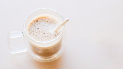 Hot coffee Cappuccino or latte with foam and copy space Minimal Food Style.