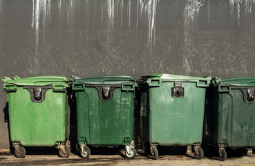 Large trash bins on wheels on asphalt for the disposal of waste from the Coronavirus epidemic