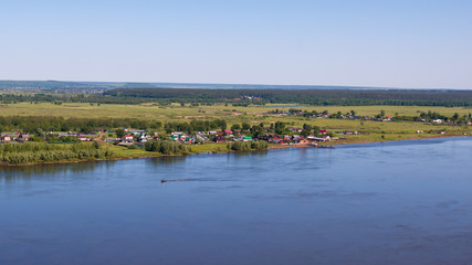 village on the low bariver Kama between high and low banks, view from the high bannk of the river Kama, view from the high bank