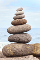 Balanced stone stack on a beach.