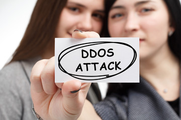 Business, technology, internet and network concept. Young businessman shows a keyword: Ddos attack