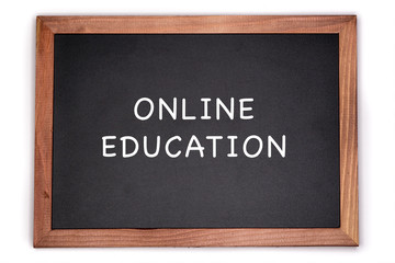 Online education written on chalkboard, white background