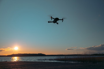 Drone on a sunset background. There is a place for text