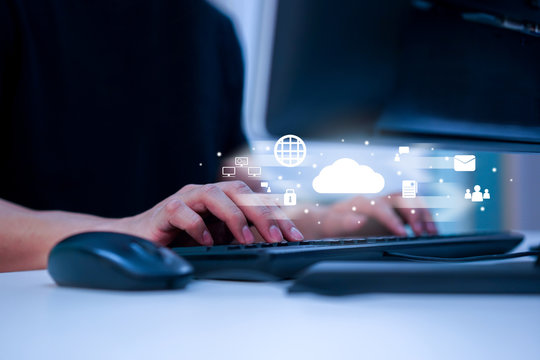 close up man hand touch screen on smart phone to transfer or synch data upload with laptop and download from cloud computing storage technology service with virtual interface for futuristic concept