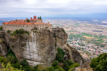 Fototapeta na wymiar Monastery on a High Cliff Above the Town