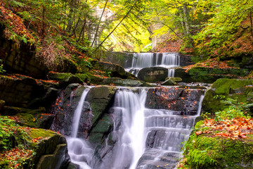 Forest Waterfall and Old Stone Bridge