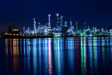oil refinery industry plant in twilight morning with a reflection in the river. Bangkok Thailand.