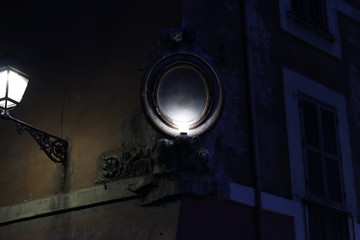 old roman street lamp and mirror