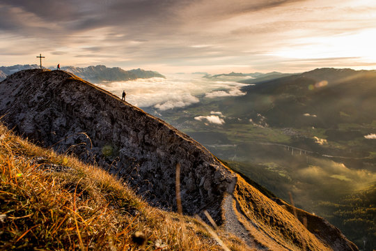 Wanderer during sunrise on the Nockspitze