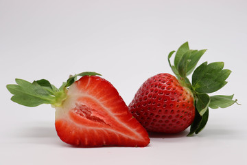 strawberries  with leaves on a white background