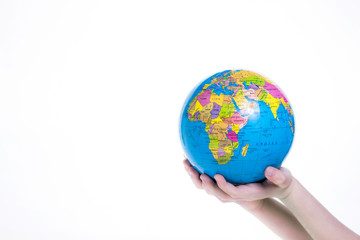 Earth in child hand. World protection concept. Globe in hands isolated on white background. 
