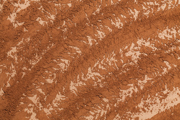 Smashed cocoa powder rows top view.