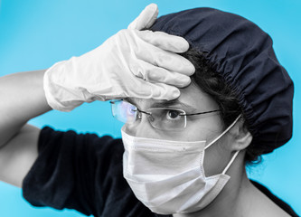 Sick girl in a medical mask on a blue background