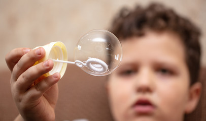 Soap bubble in the hand.