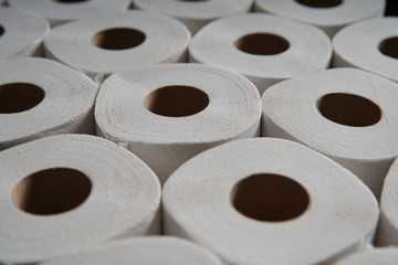 Toilet paper roll accumulation on production line. background