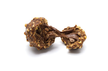 Inside of Chocolate ball sweets filling with nuts and luxury delicious isolated on white background.