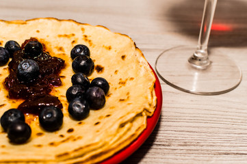 Pancakes made at home with a lot of blueberry and some sweet gem