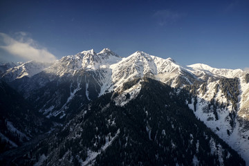 Snow Rocky Mountains at sunrise with Blue Sky in Kazakhstan