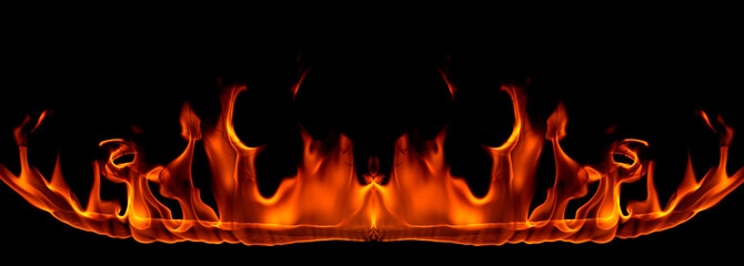 On fire flames at the black background, Burning red hot sparks rise, Fiery orange glowing flying...