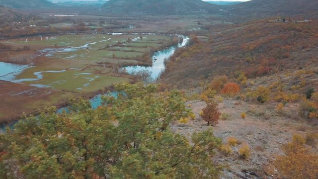 Reflection of Clouds in the Blue Autumn River. Swampy Landscape Matica River Plane. Aerial Footage of a Swampy River and Green Flooded Fields From a Bird's Eye View. Rijeka Matica kod Luznice Komani