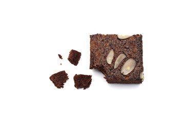 Chocolate brownie with sliced almond nuts toppings crumbs isolated on white background.