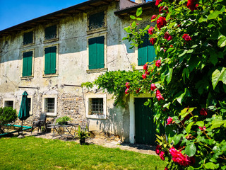 Fototapeta na wymiar Typical farm house in the green countryside of the hills of Veneto, Italy.