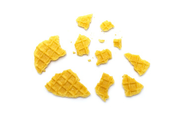 Crumbs of waffle crisp butter flavor biscuits isolated on white background.
