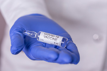 Immunologist holding novel coronavirus vaccine