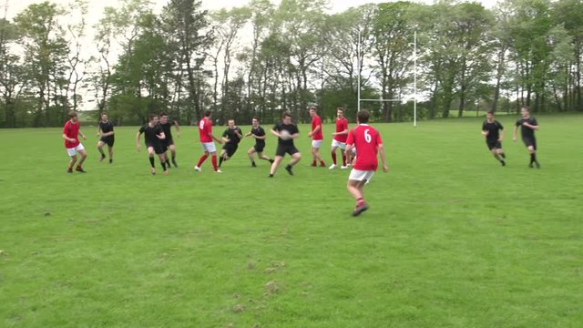 Scoring a try in Rugby. Action from a match resulting in one of the teams getting the ball over the line. Stock Video Clip Footage
