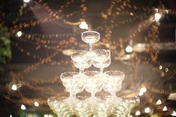 Stack small tower of champagne glass for the bride and groom for pouring champagne at the Wedding...