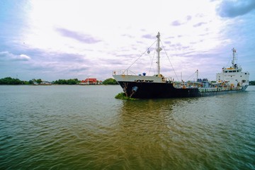 Fototapeta premium Logistics and transportation of cargo ship in the ocean.