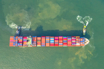 Container , container ship in export and import business and logistics. Shipping cargo to harbor by...