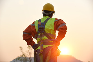 Engineers in the yellow hat, warm handshake, visit the site, construction concepts and modern...