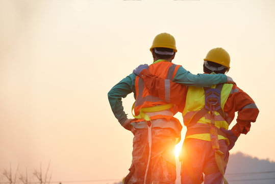 Engineers in yellow helmet and the best greetings with the warm handshake team Visit the website Modern construction and engineering concepts Safety at work in production and construction sites